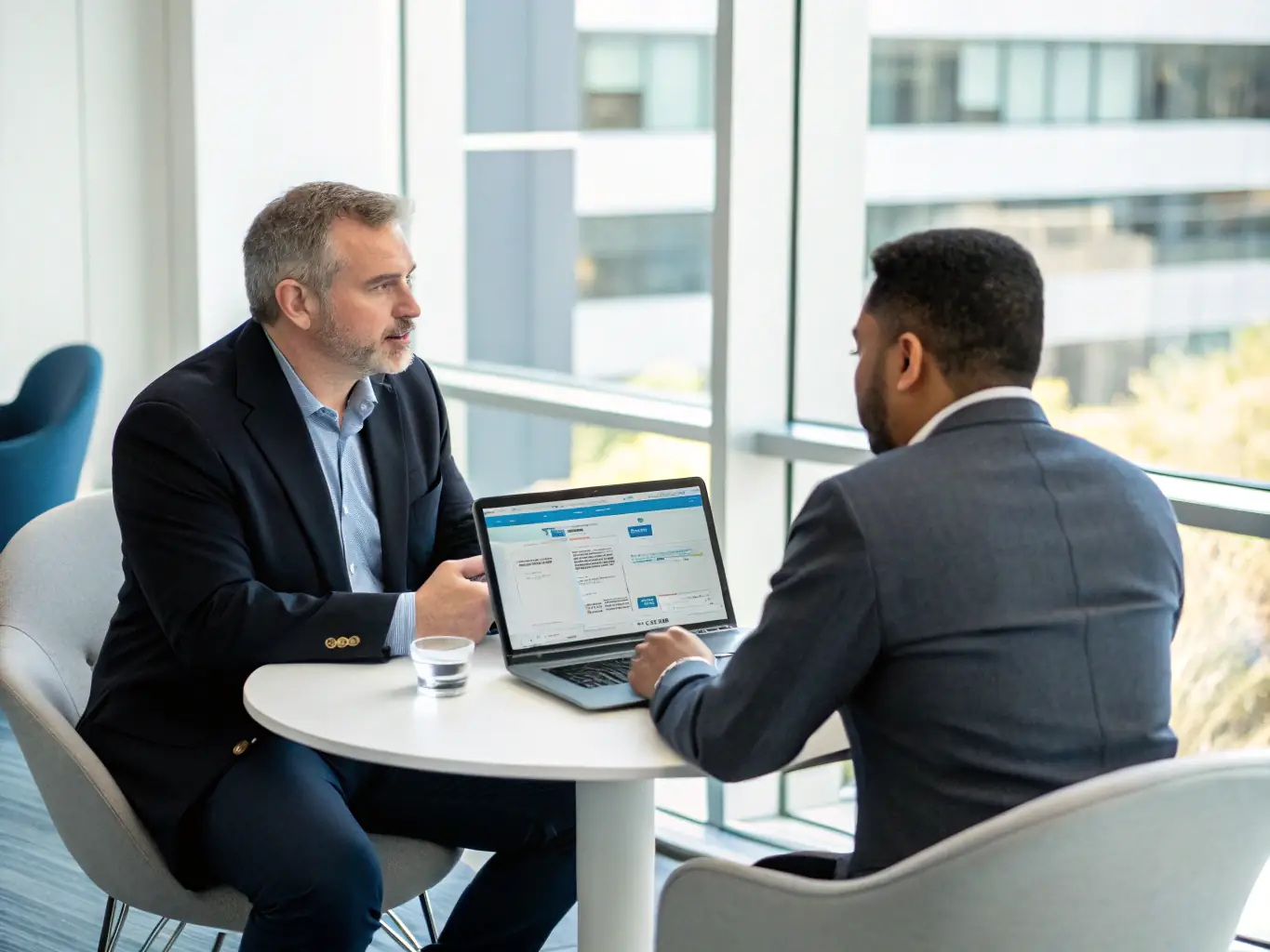 An image of Robert Davis engaging with a client in a professional setting, discussing Salesforce strategies.